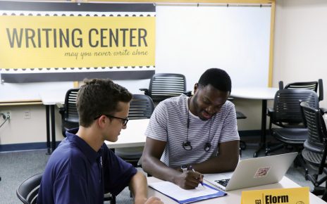 Student working with Writing Center tutor